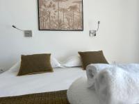 Posteľ alebo postele v izbe v ubytovaní Appartements Les Lofts de Sainte-Lucie-de-Porto-Vecchio