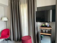 Villa Clementina Boutique Hotelにあるテレビまたはエンターテインメントセンター