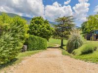 a dirt road with bushes and a tree on a hill at Holiday Home Le Cèdre - RSB100 by Interhome in Roche-Saint-Secret