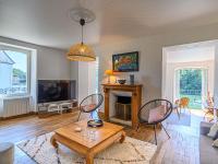 Televízia a/alebo spoločenská miestnosť v ubytovaní Holiday Home Glann Aven by Interhome