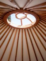 a round window in a yurt roof at Yourtissimo in Laprugne
