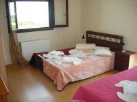 A bed or beds in a room at Zante View Studios & Villas
