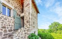a stone house with a green door and a window at Amazing Home In Essertines-en-chtelne With 3 Bedrooms in Essertines-en-Châtelneuf