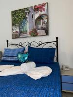 Postel nebo postele na pokoji v ubytování Rethymno Blue Apartments