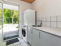 Kuchyň nebo kuchyňský kout v ubytování 12 person holiday home in Væggerløse-By Traum