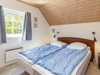Postel nebo postele na pokoji v ubytování 12 person holiday home in Væggerløse-By Traum