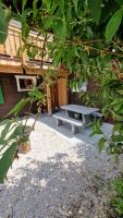 a picnic bench sitting in front of a building at Chalet-Daheim-Fiesch 3,5-Zimmerwohnung in Fiesch