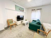 Televízia a/alebo spoločenská miestnosť v ubytovaní Apartamentos Villa Torcal
