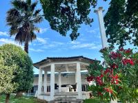 a white chapel with a cross on top of it at Mas La Farelle Chambre d&#39;hote,Fitness &amp; Salle de jeux Gratuite &amp; SPA en supplément in Nîmes