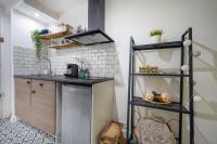 a kitchen with a counter and a shelf at Gallia Blue By SCLS Locations in Cannes