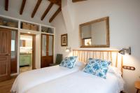 A bed or beds in a room at Miraverde Liérganes