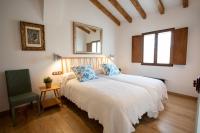 A bed or beds in a room at Miraverde Liérganes