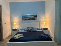 A bed or beds in a room at Librari - Quality confort