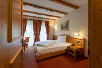 A bed or beds in a room at Hotel Lido - slow & natural living