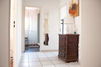 a hallway with a dresser and a lamp at Villa Bougainvilliers in Banyuls-sur-Mer