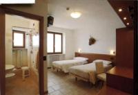 Posteľ alebo postele v izbe v ubytovaní Hotel Scandola