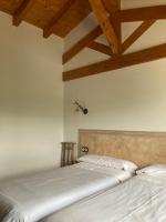 Postel nebo postele na pokoji v ubytování Apartamentos Rurales Casa Lafuente