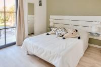 A bed or beds in a room at Evasion a deux pas de la plage a Penmarch
