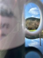 a view of a reflection in a mirror of a car at Le Repère des Quatre Dubois in Le Tholy