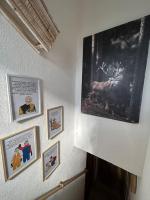 a room with pictures on the wall at Le Repère des Quatre Dubois in Le Tholy