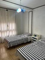 Posteľ alebo postele v izbe v ubytovaní Costa Daurada Apartaments - APARTAMENTO ARAGON
