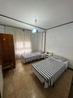 Posteľ alebo postele v izbe v ubytovaní Costa Daurada Apartaments - APARTAMENTO ARAGON