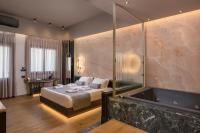 A bed or beds in a room at Agave Suites