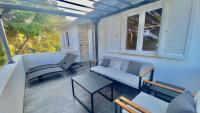 Posedenie v ubytovaní Nautilus-Bay Holiday home with 5 rooms, on the beach, for 2-9 persons
