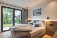 Postel nebo postele na pokoji v ubytování Thalhof Apartments
