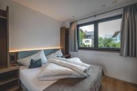 Postel nebo postele na pokoji v ubytování Thalhof Apartments
