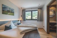 Postel nebo postele na pokoji v ubytování Thalhof Apartments