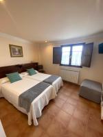 Postel nebo postele na pokoji v ubytování Hotel rural Monasterio de Ara Mada