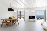 A television and/or entertainment centre at NEW - Villa Aperanto - MG Villas Mykonos