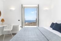 A bed or beds in a room at NEW - Villa Aperanto - MG Villas Mykonos