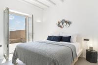 A bed or beds in a room at NEW - Villa Aperanto - MG Villas Mykonos