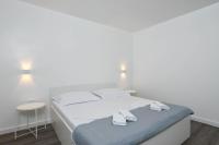 Postel nebo postele na pokoji v ubytování Apartments Marina