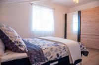 Posteľ alebo postele v izbe v ubytovaní Apartmani Lavanda