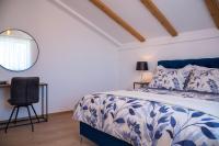Posteľ alebo postele v izbe v ubytovaní Apartmani Lavanda