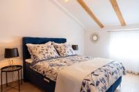 Posteľ alebo postele v izbe v ubytovaní Apartmani Lavanda