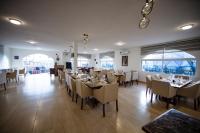 a dining room with tables and chairs in a restaurant at Petra Seasons luxury Resort in Al Ḩayy