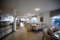 a dining room with tables and chairs in a restaurant at Petra Seasons luxury Resort in Al Ḩayy