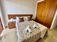 Postel nebo postele na pokoji v ubytování Costa Adeje Sunset Apartment