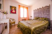 a bedroom with a bed and a table and a window at Grande Villa à Sainte Maxime - Golfe de Saint Tropez in Sainte-Maxime