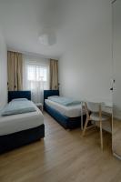 Łóżko lub łóżka w pokoju w obiekcie Apartamenty MM - Rzeźniczaka