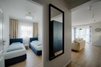 Łóżko lub łóżka w pokoju w obiekcie Apartamenty MM - Rzeźniczaka