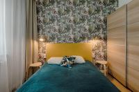 Łóżko lub łóżka w pokoju w obiekcie Apartamenty MM - Rzeźniczaka