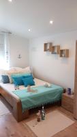 Posteľ alebo postele v izbe v ubytovaní White Stone Apartman