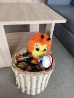 a basket under a table with a stuffed animal at Mobile homes PIA RITA in Pakoštane