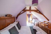 a bedroom with two beds in a attic at ROCHE-LOIRE in Le Thoureil