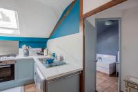 a kitchen with a sink and a stove at ROCHE-LOIRE in Le Thoureil